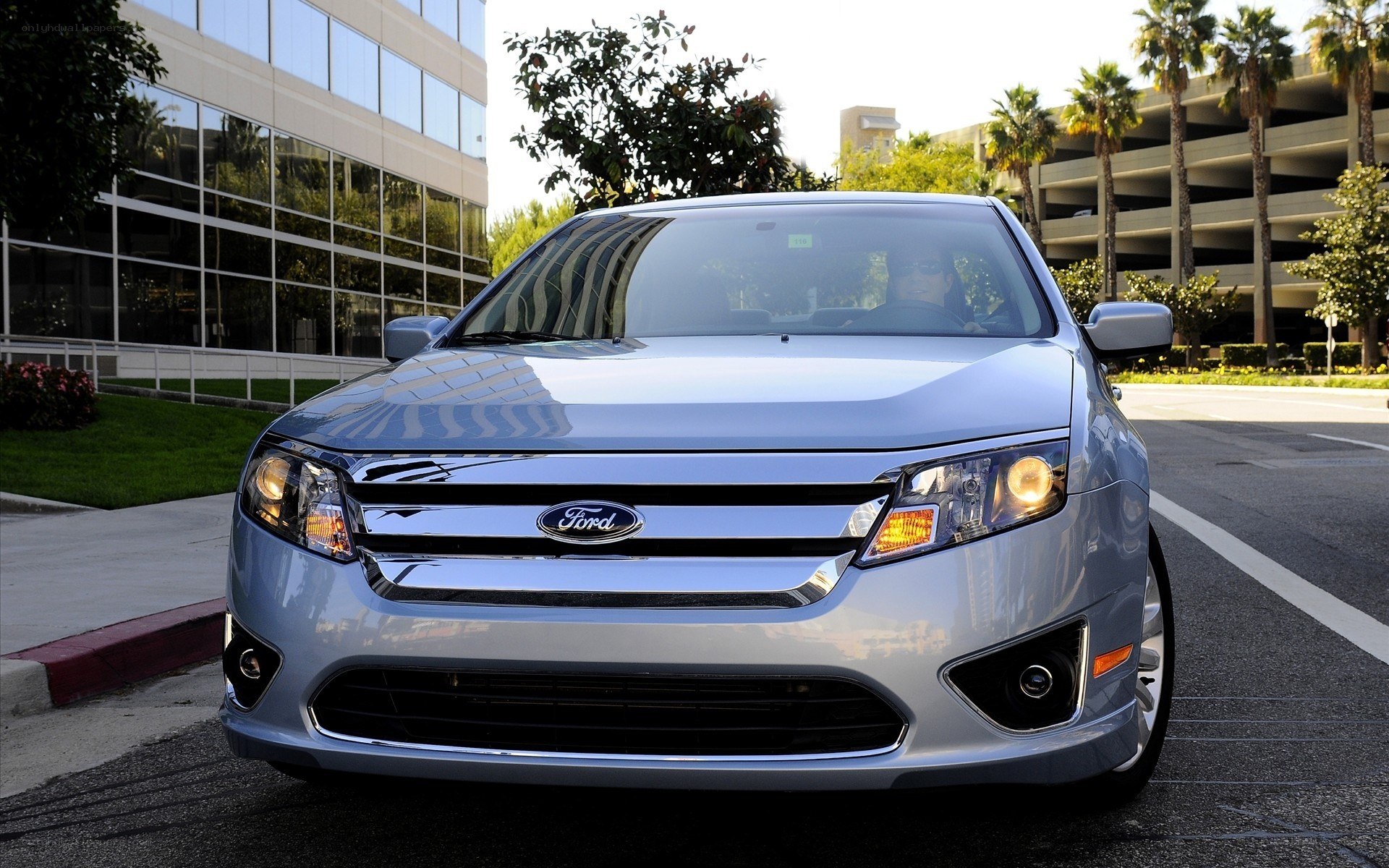 Silver Ford Fusion parked outside