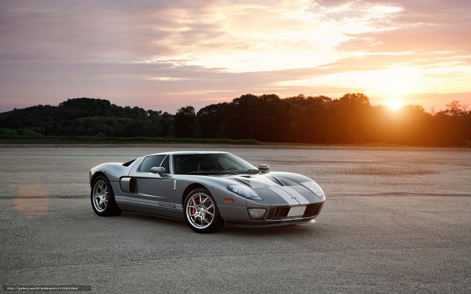 Silver Ford GT at sunset