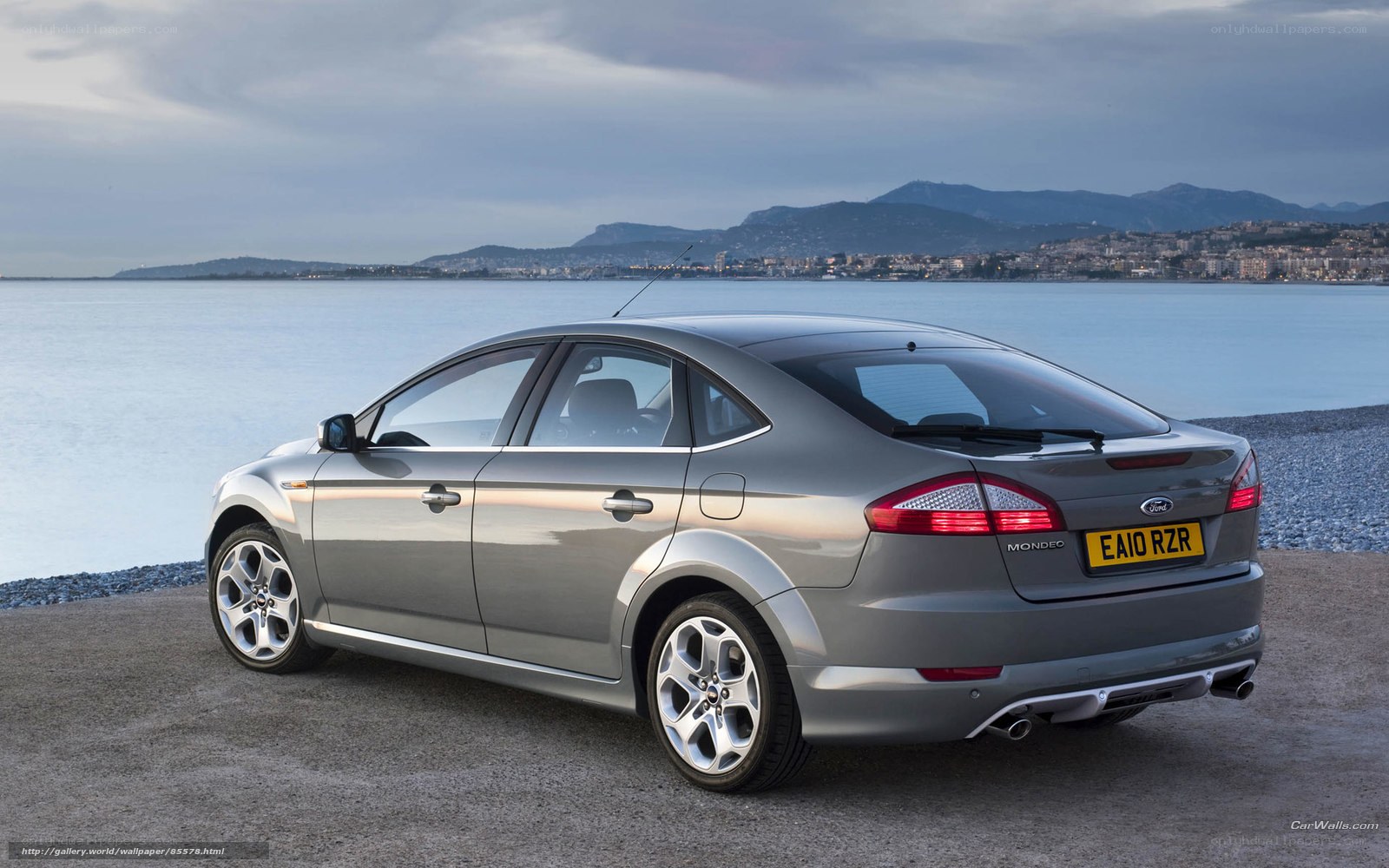 Silver Ford Mondeo by the sea