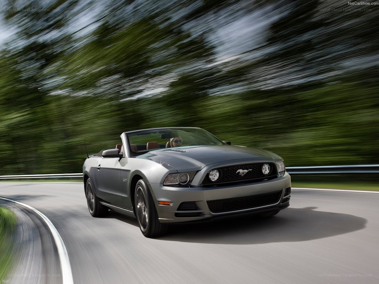 Silver Ford Mustang convertible in motion
