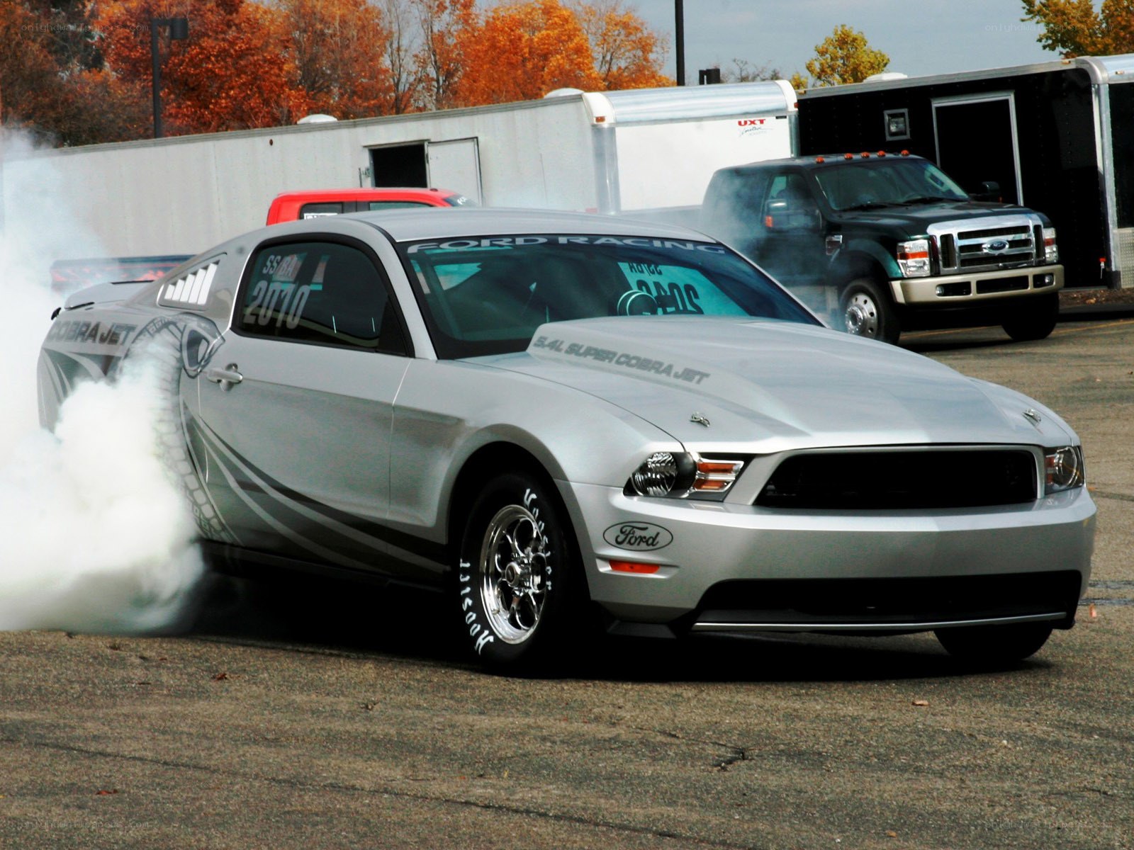 Silver Ford Mustang drag racing