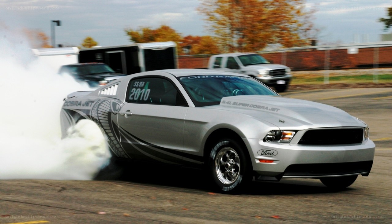 Silver Ford Mustang drag racing