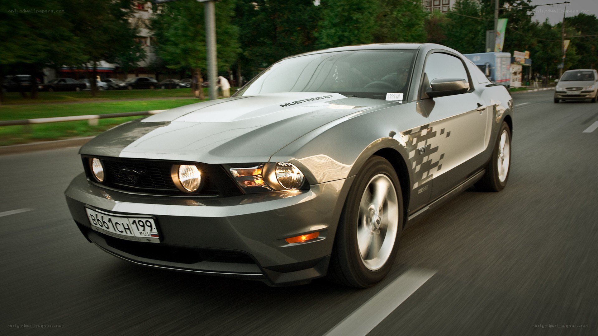 Silver Ford Mustang GT driving