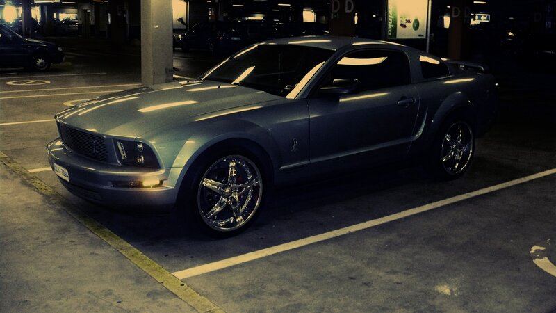 Silver Ford Mustang in parking garage
