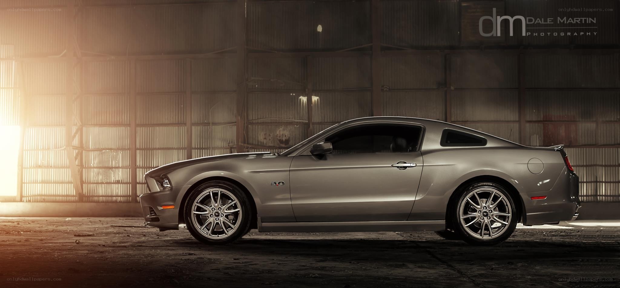 silver ford mustang in warehouse