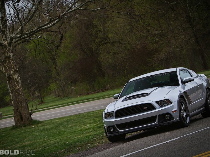 Silver Ford Mustang on a road