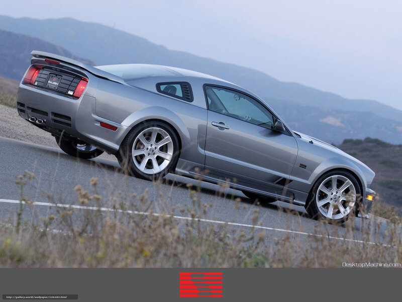 silver ford mustang on mountain road