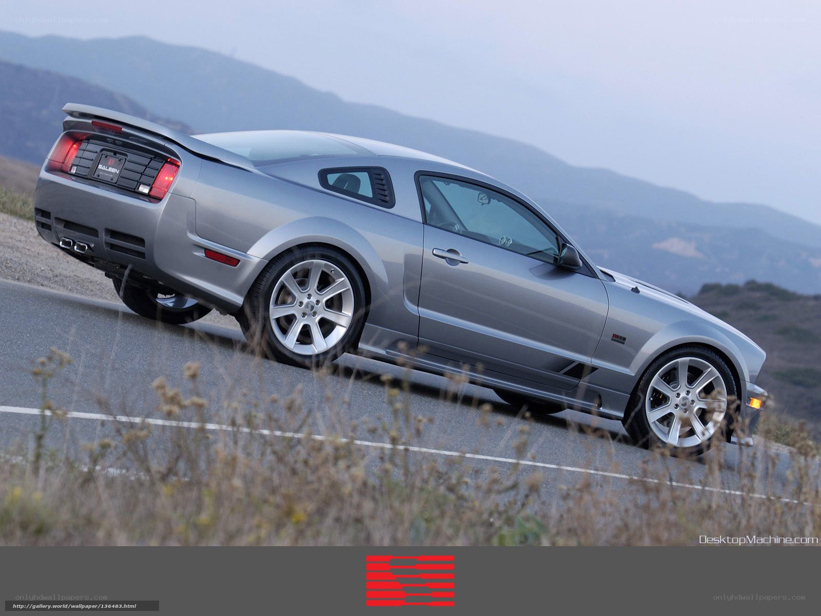 silver ford mustang on mountain road