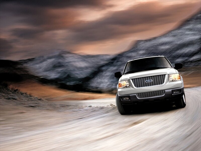 Silver Ford SUV on a winding road