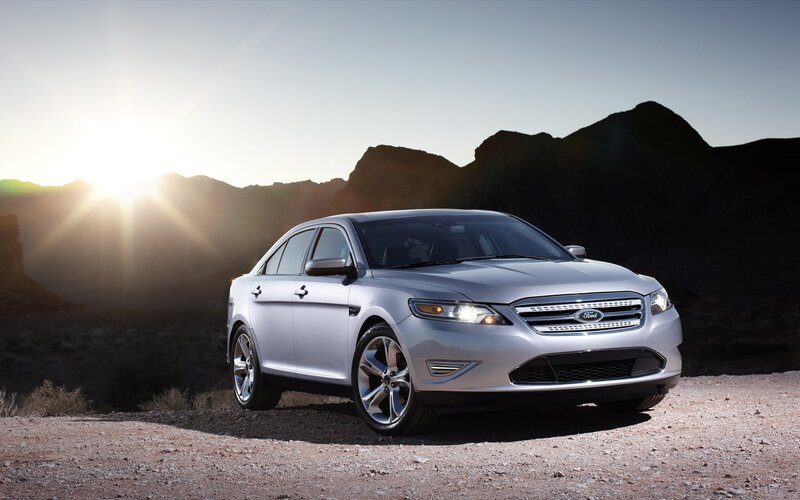 Silver Ford Taurus in desert