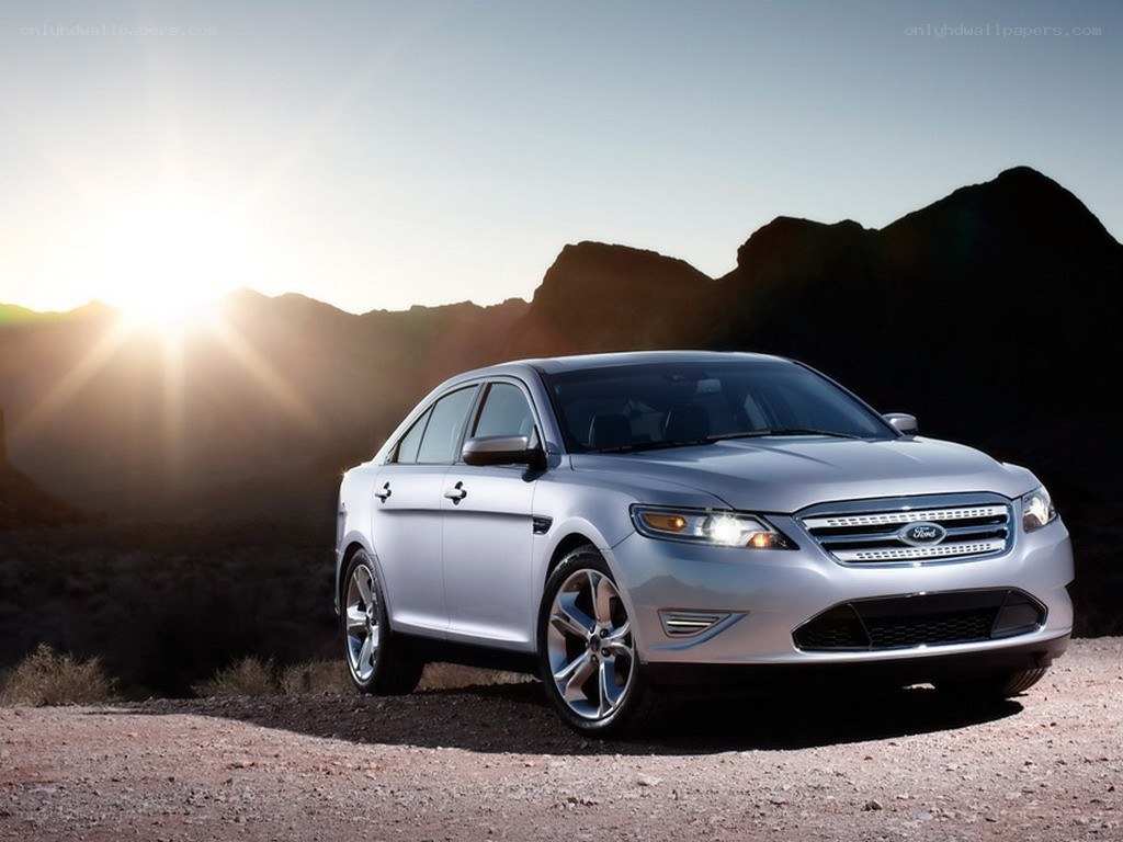 Silver Ford Taurus in desert