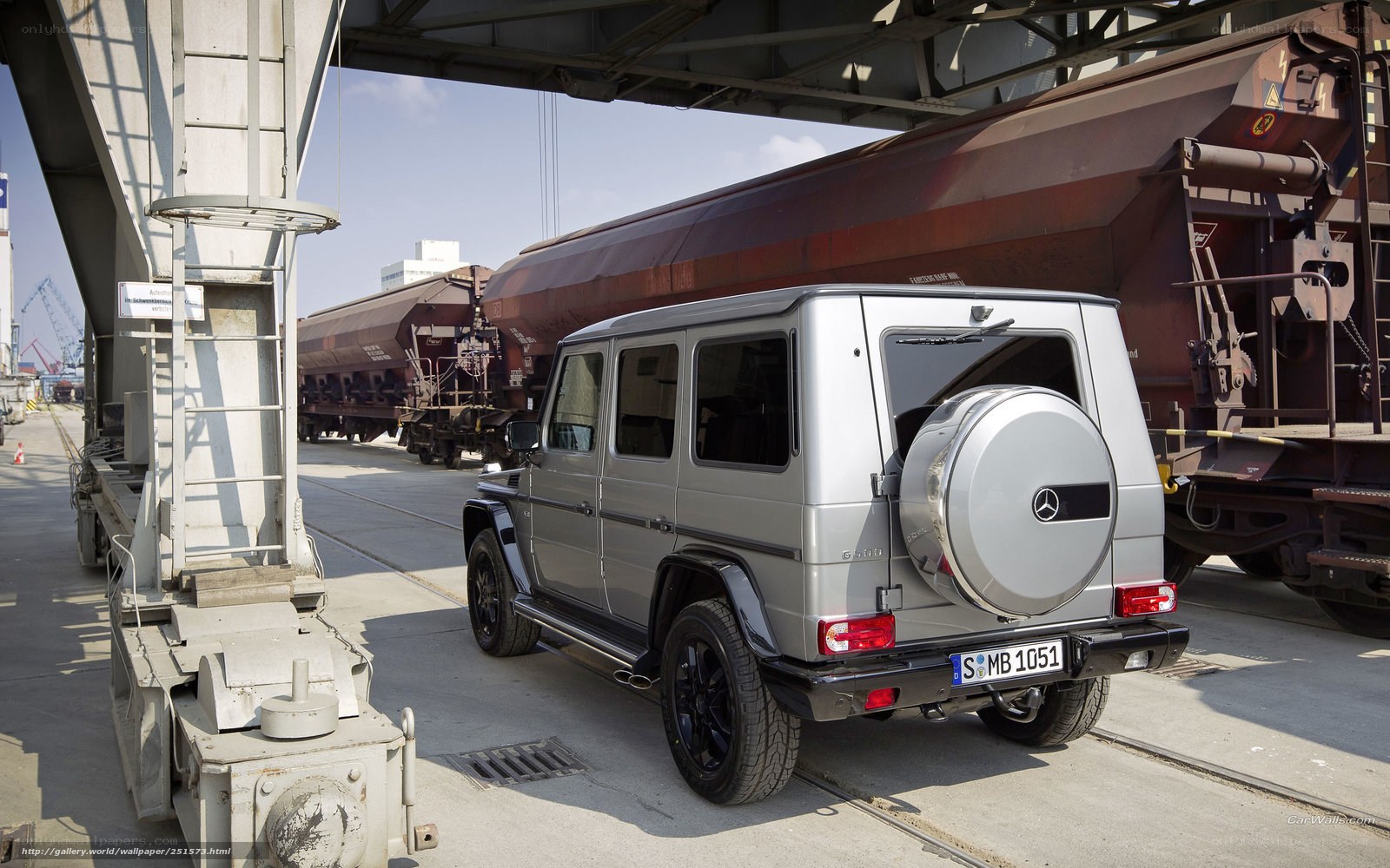 Silver G-Wagon at a rail yard