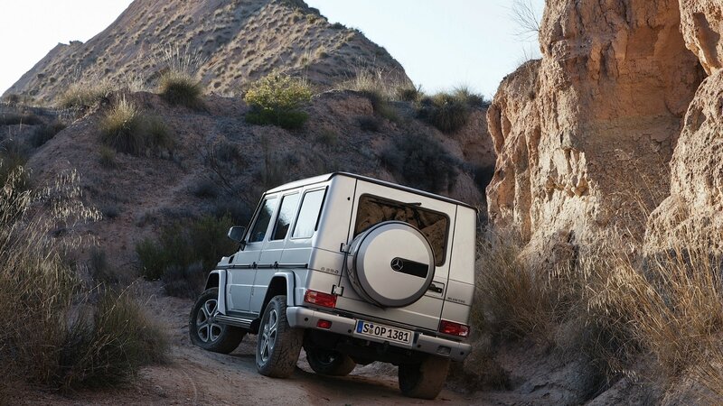 Silver G-Wagon in desert canyon