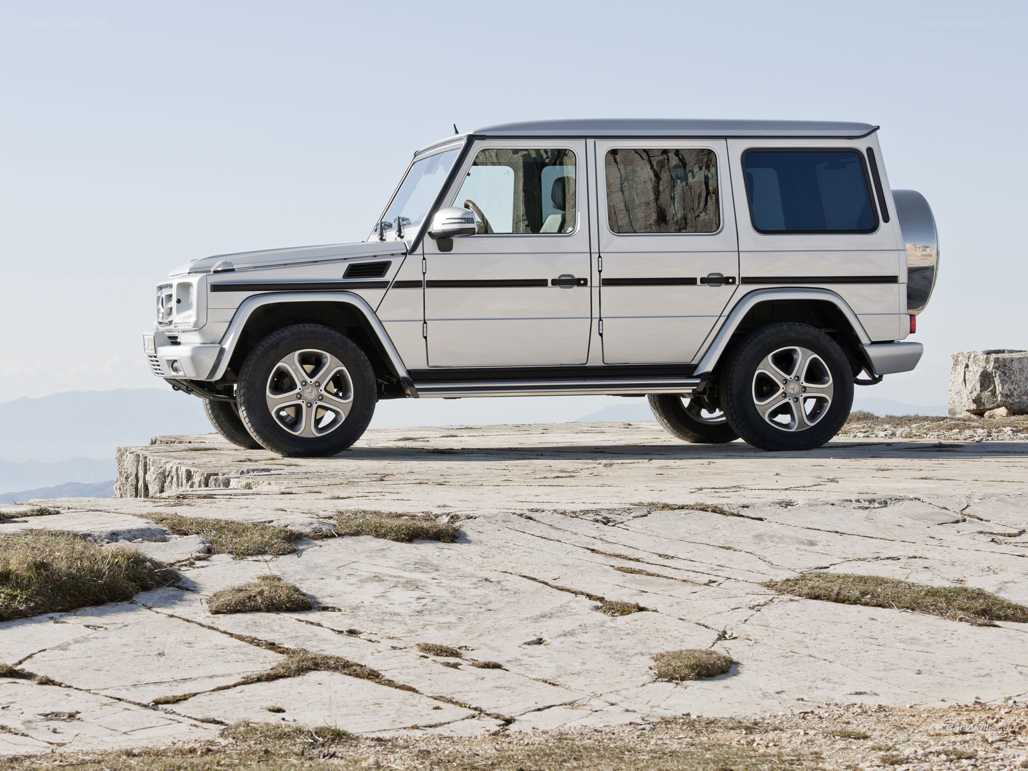 Silver G-Wagon on a cliff