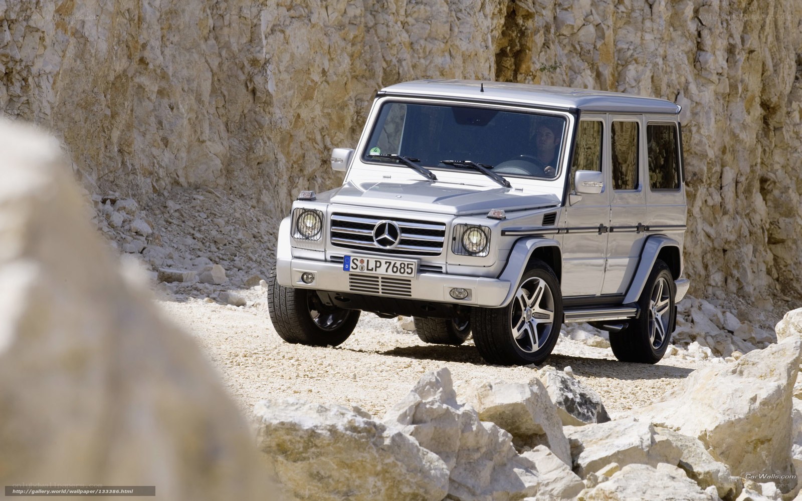 Silver G-Wagon on rocky terrain