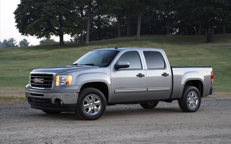 Silver GMC Sierra Hybrid truck