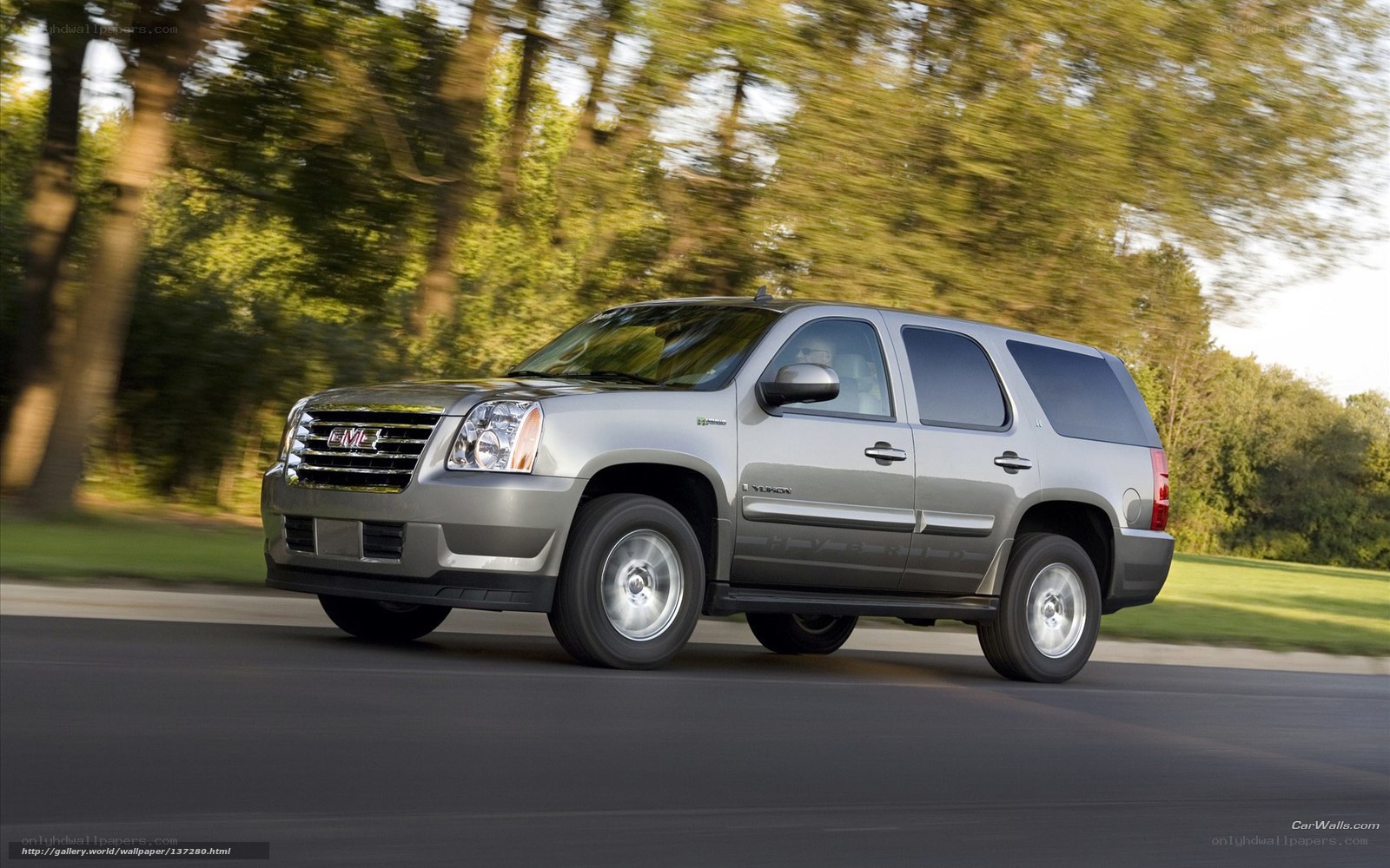 silver gmc yukon driving