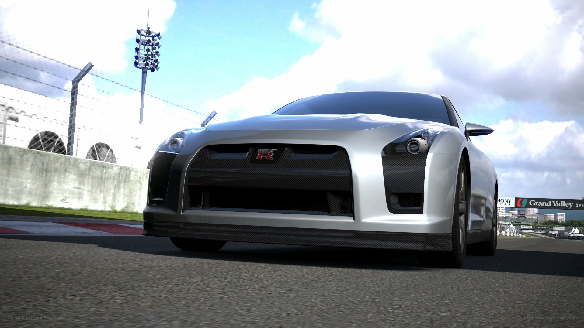 Silver GT-R on a racetrack