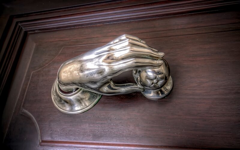 silver hand door knocker
