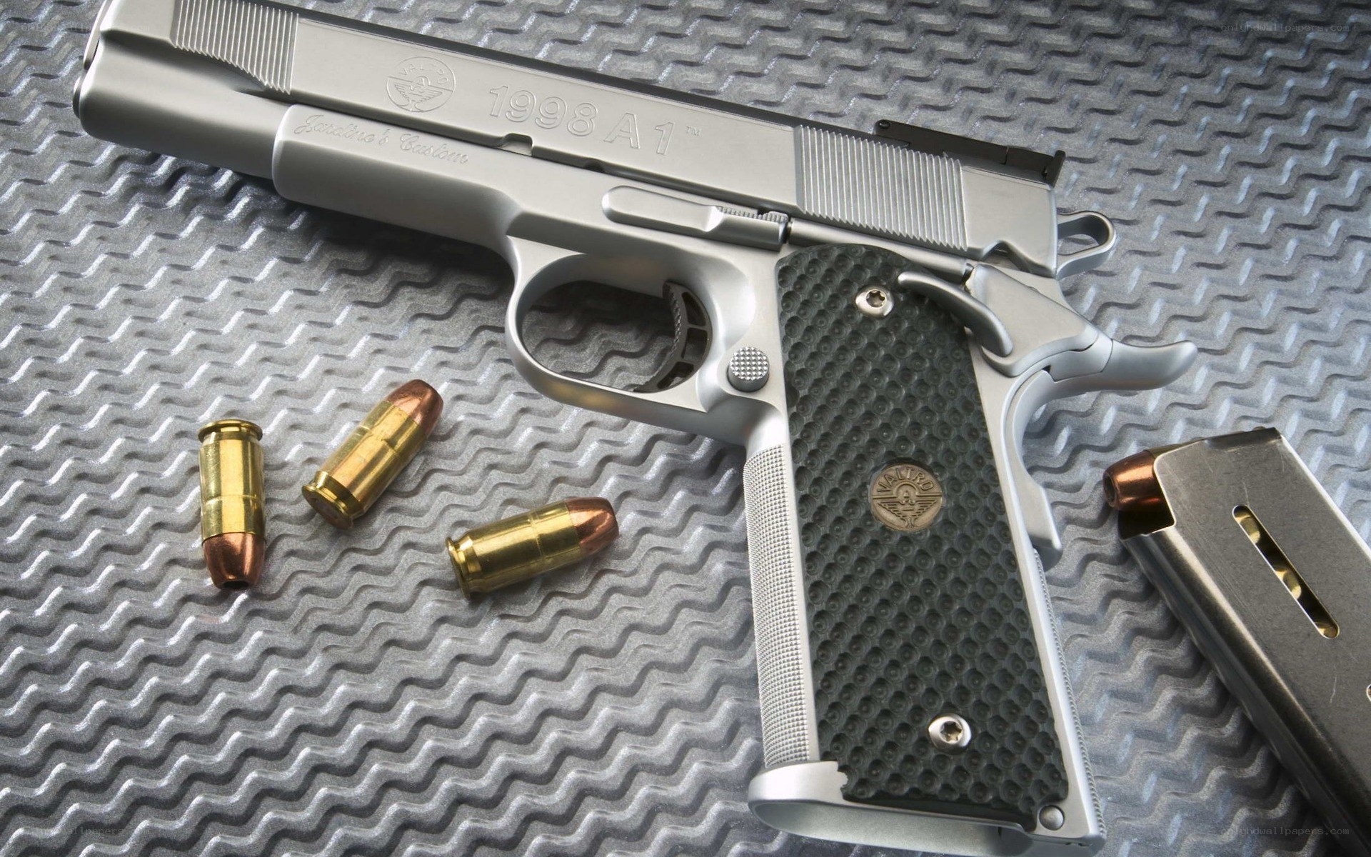silver handgun with bullets