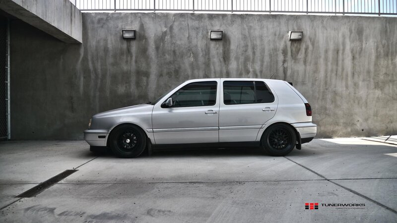 Silver Hatchback Car — Gray, Dramatic, Afternoon, Photograph, Concrete Wall