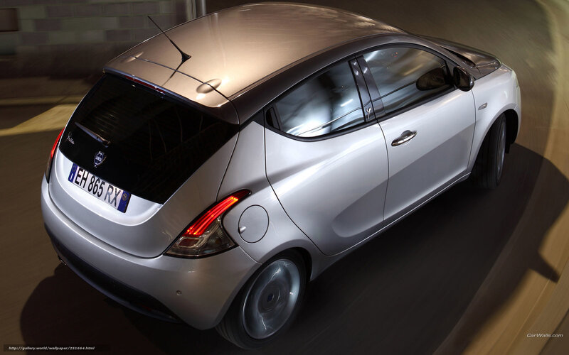silver hatchback car in motion