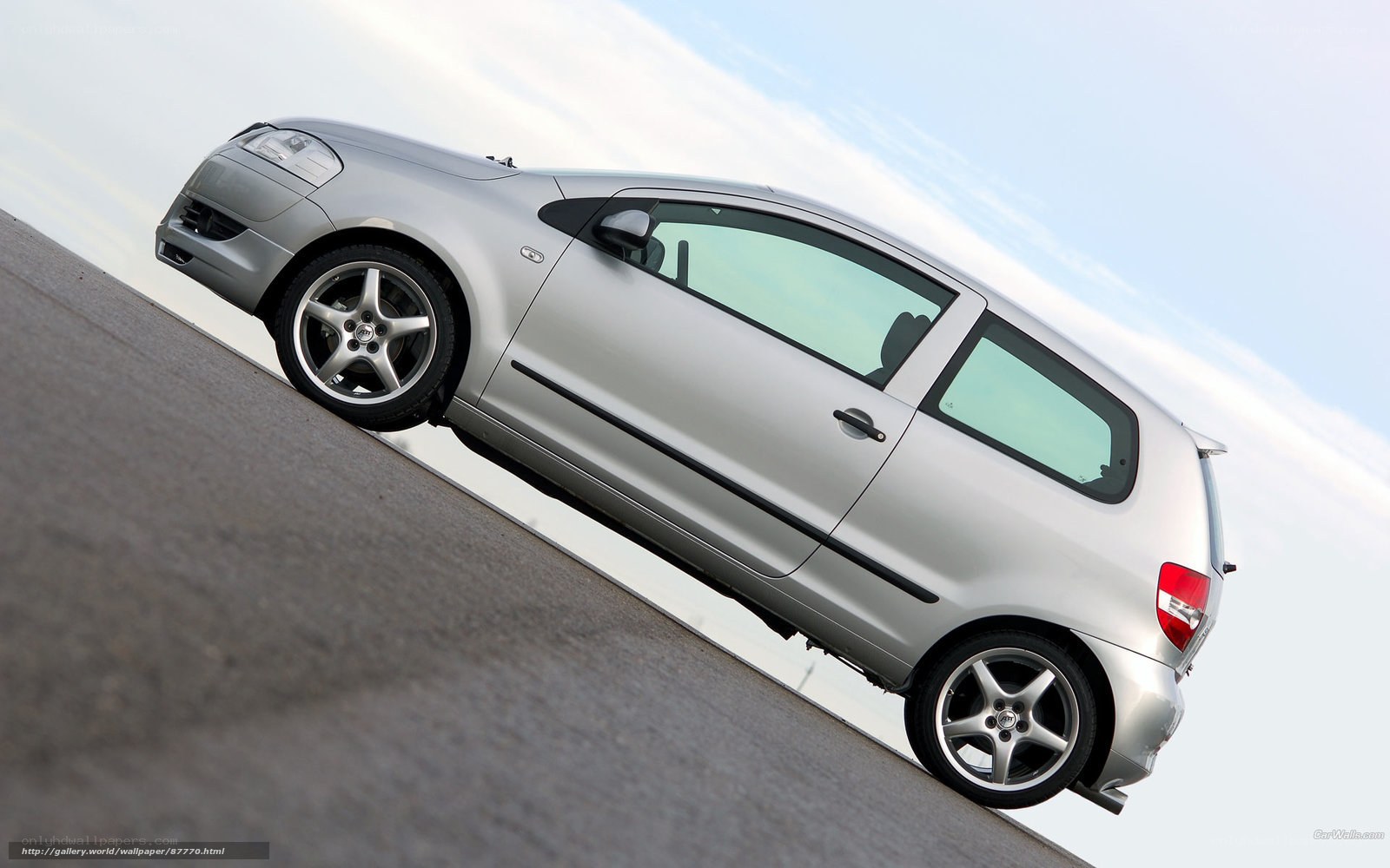 silver hatchback on incline