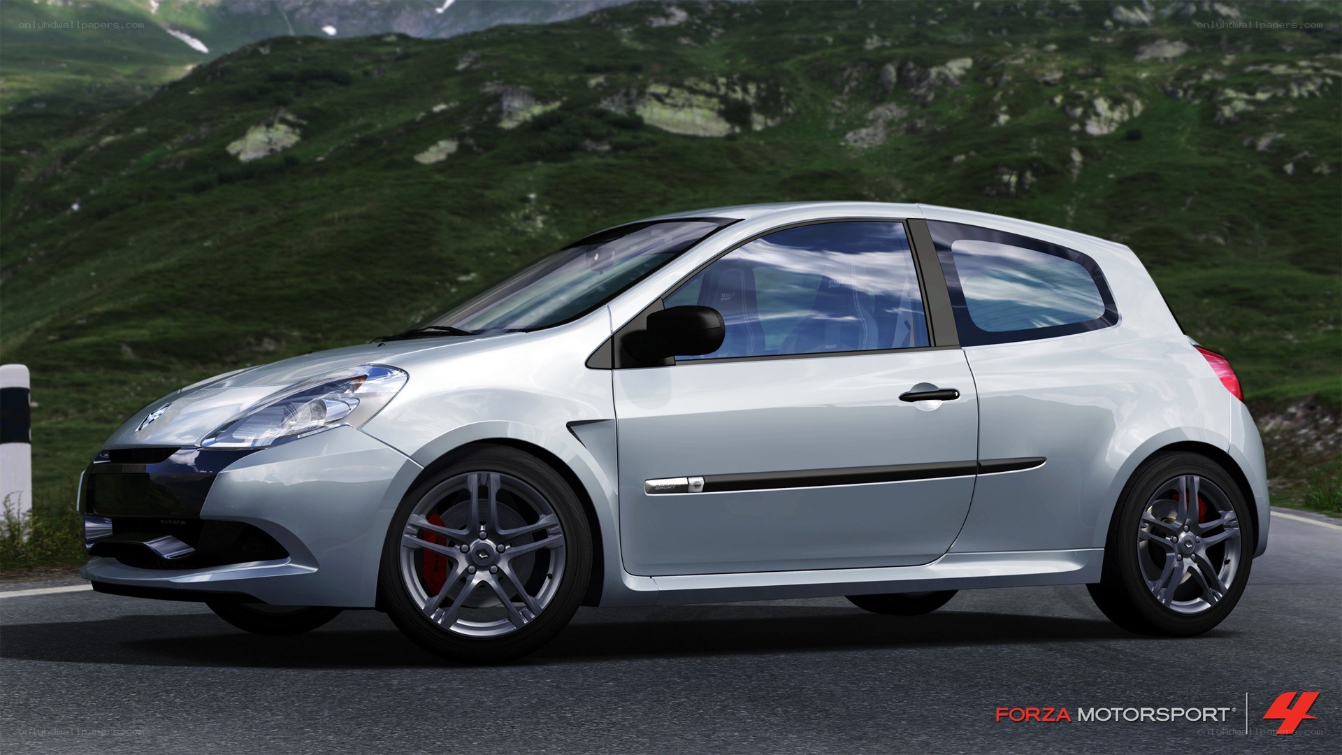 silver hatchback on mountain road