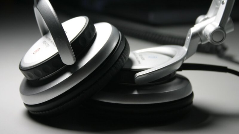 silver headphones on a table