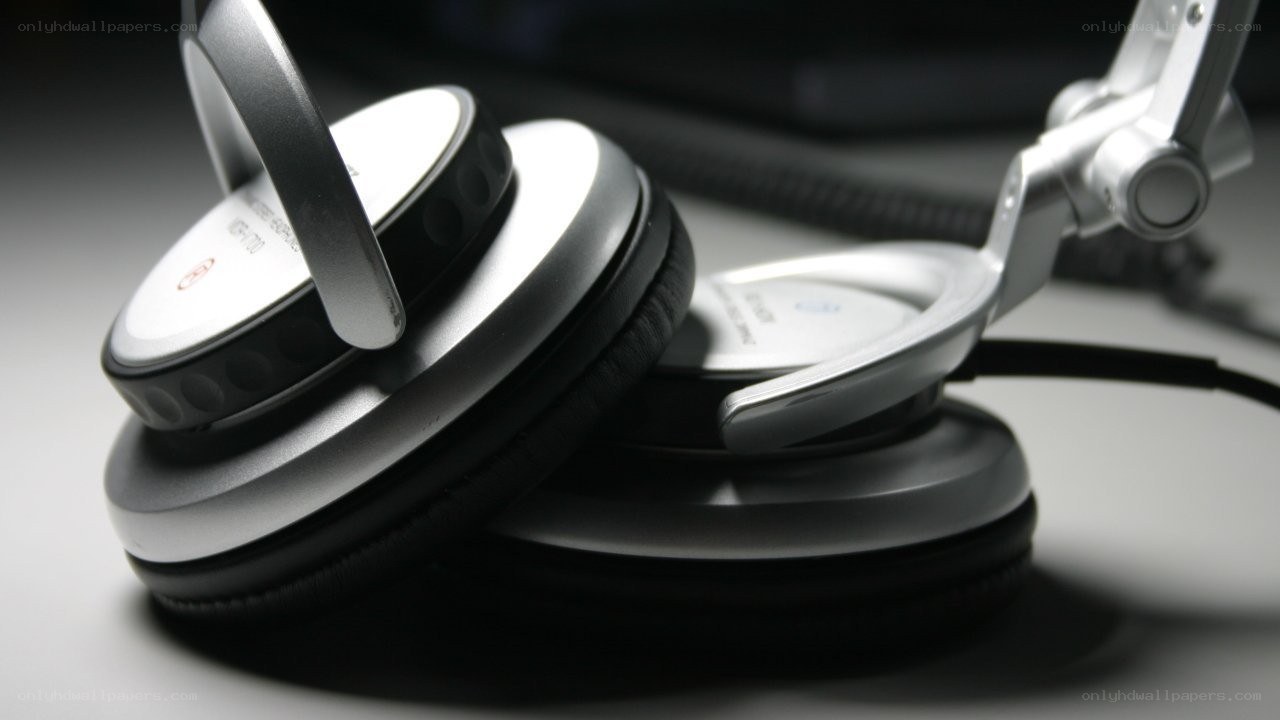 silver headphones on a table