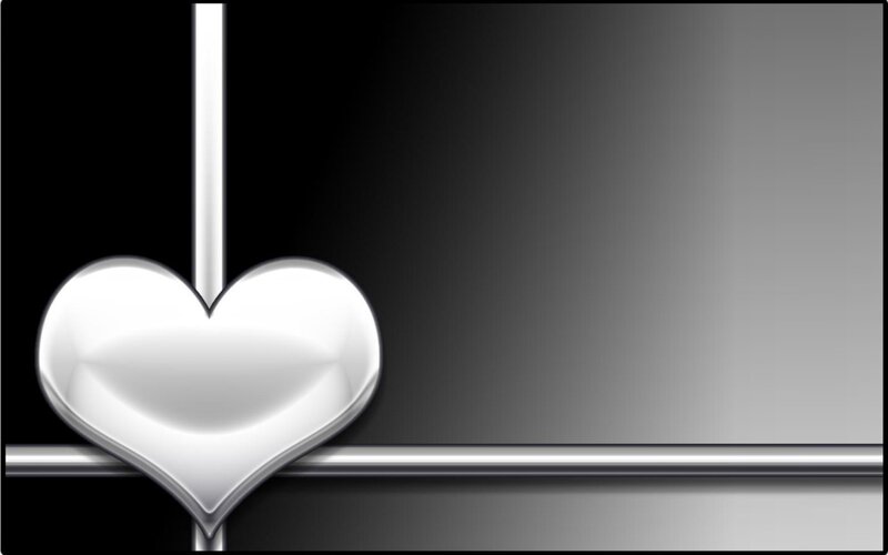 silver heart on black background