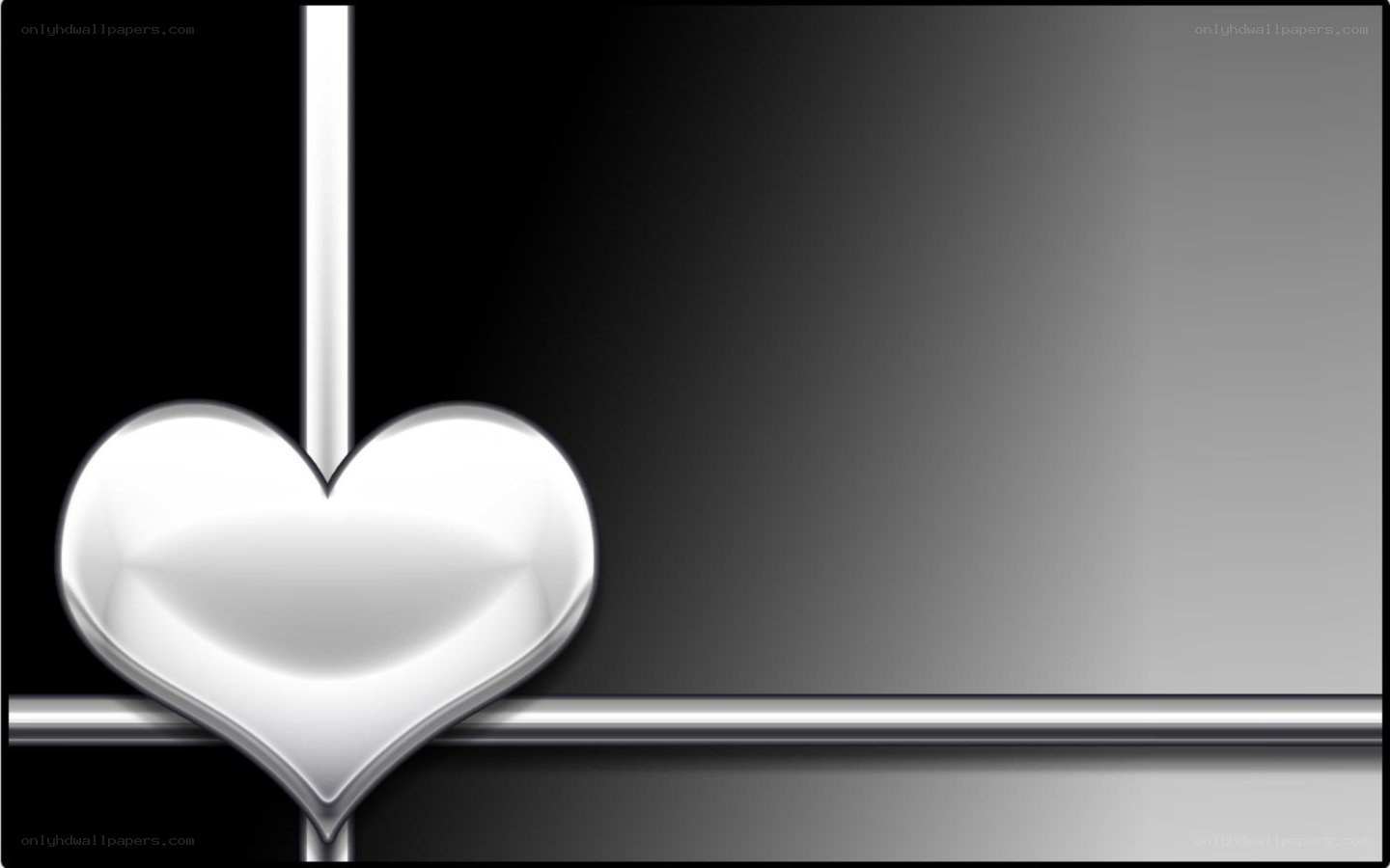 silver heart on black background