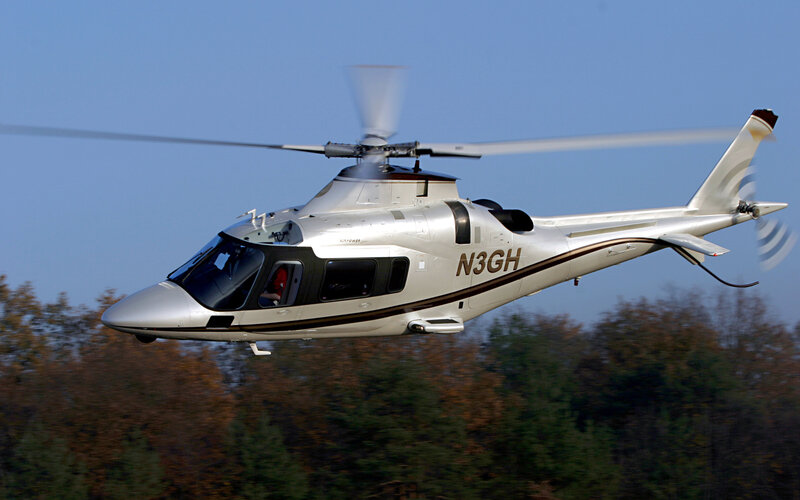 silver helicopter in flight