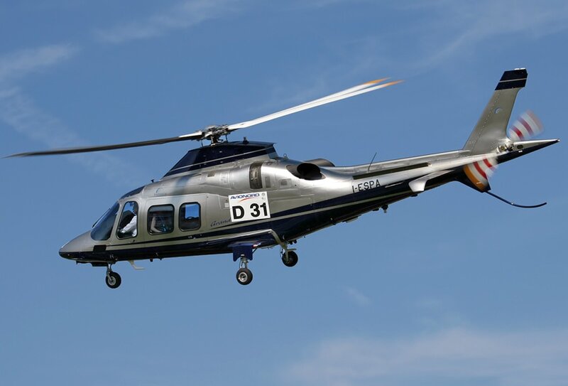 Silver helicopter in flight