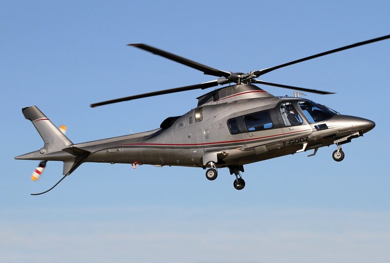 Silver Helicopter in Flight — Gray, Calm