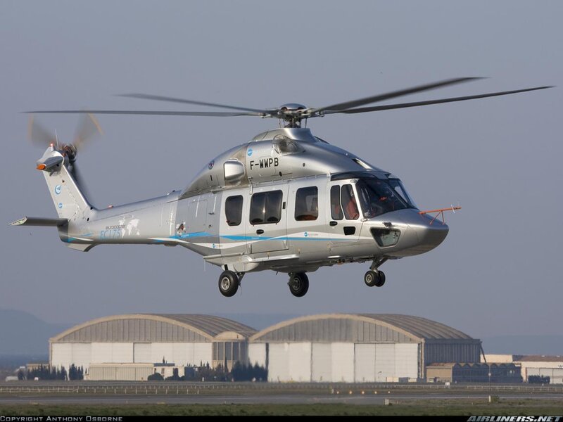 Silver Helicopter in Flight — Gray