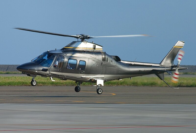 Silver Helicopter on Runway