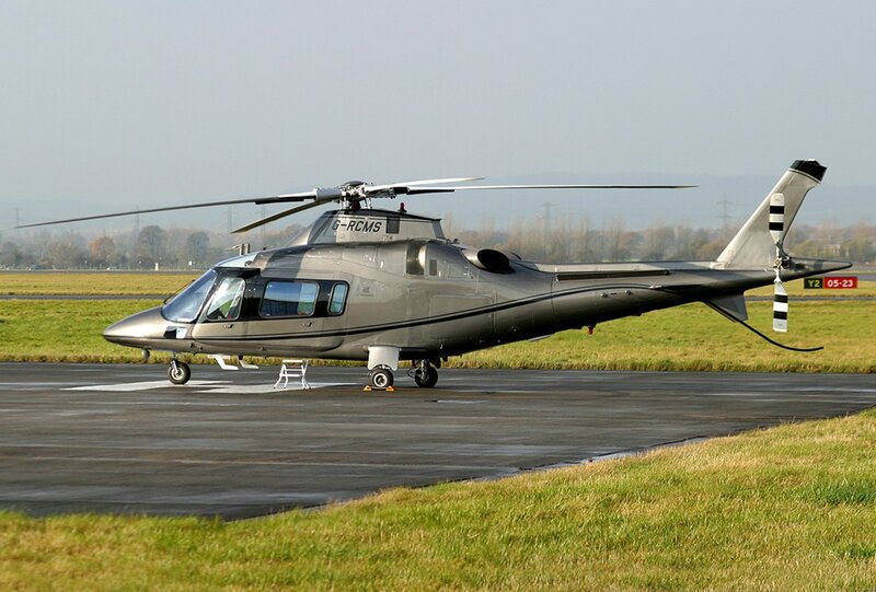 Silver helicopter on tarmac