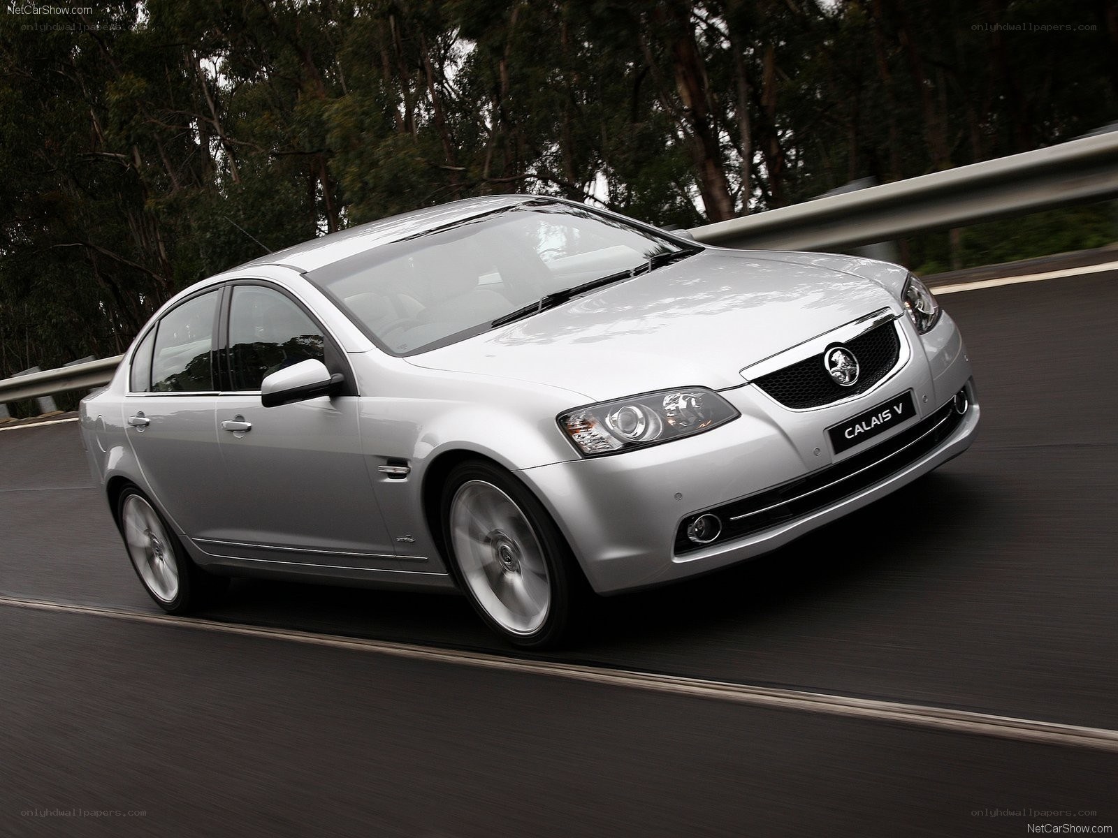 silver Holden Calais V driving