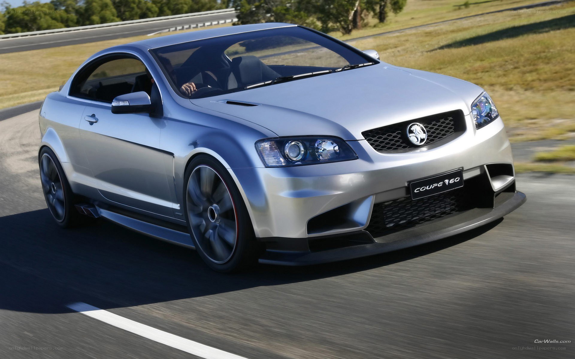 Silver Holden Coupe 60 on track