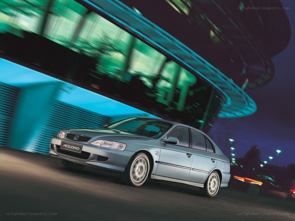 Silver Honda Accord in motion