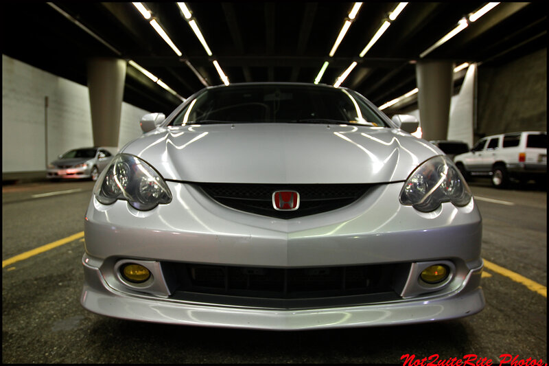 silver honda acura in parking garage