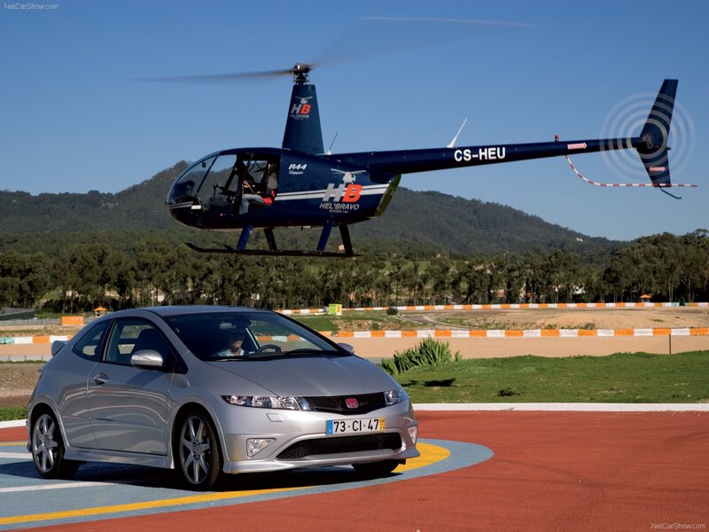 Silver Honda Civic and helicopter