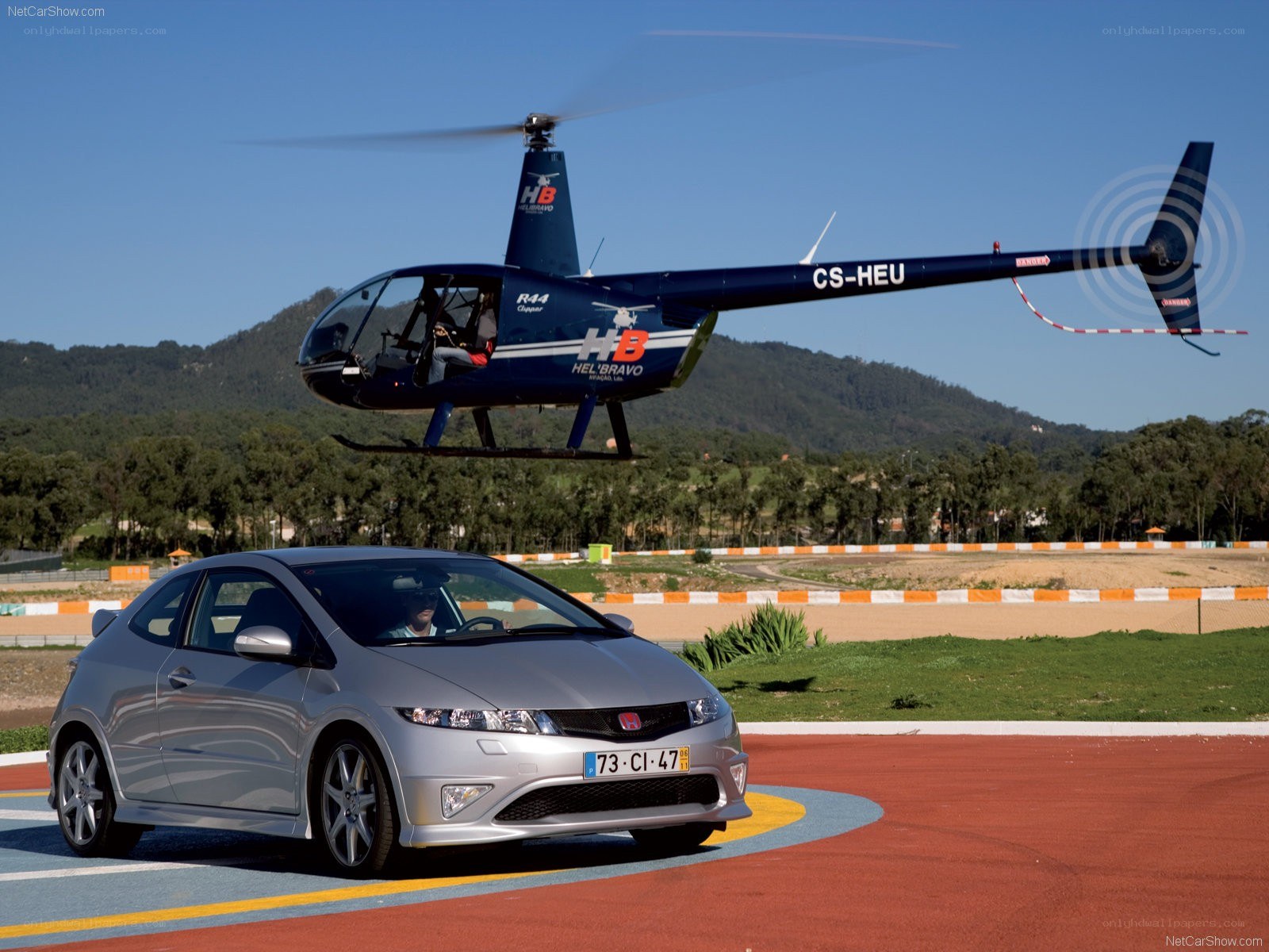 Silver Honda Civic and helicopter
