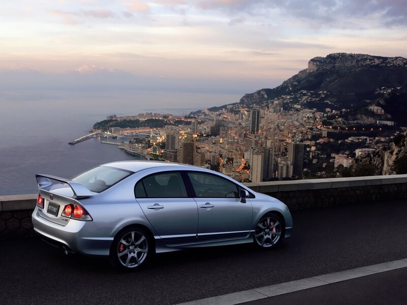 Silver Honda Civic on coastal road