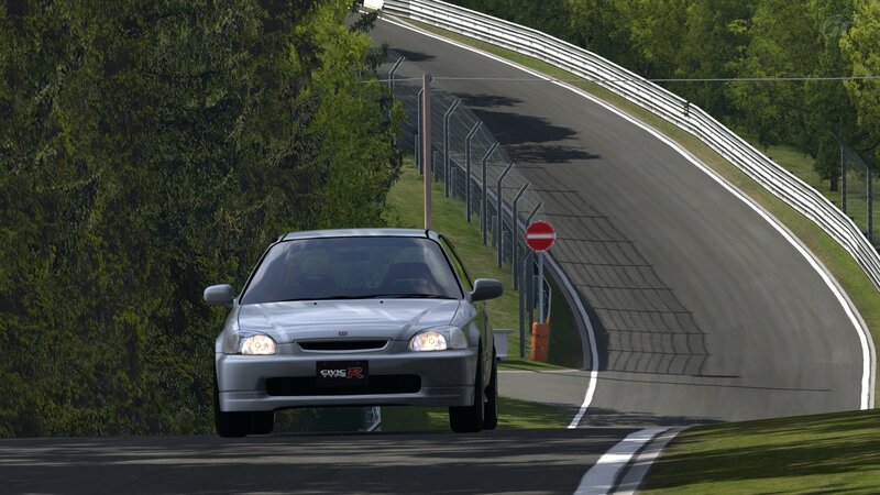 Silver Honda Civic R on a racetrack