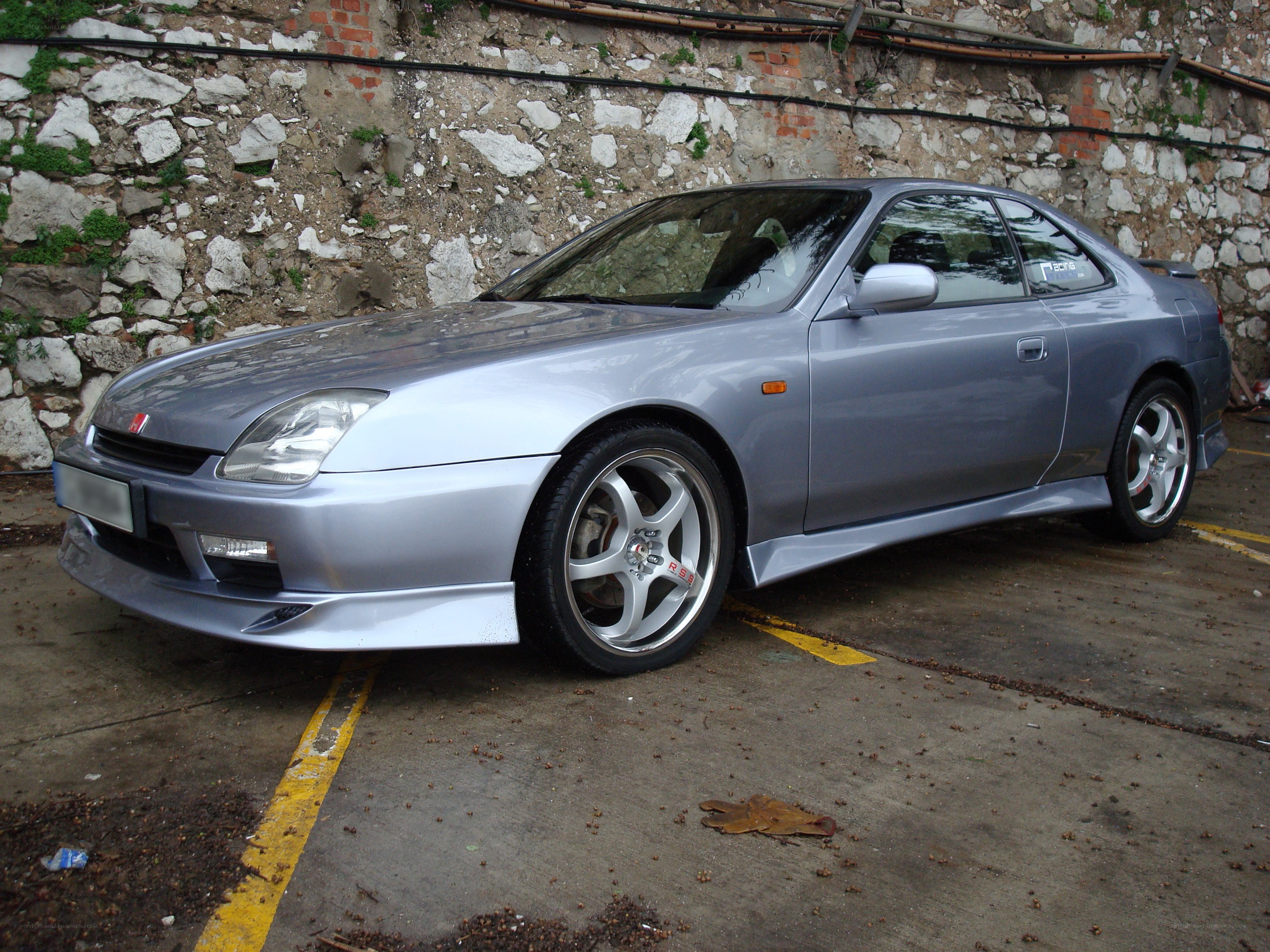 silver honda coupe parked