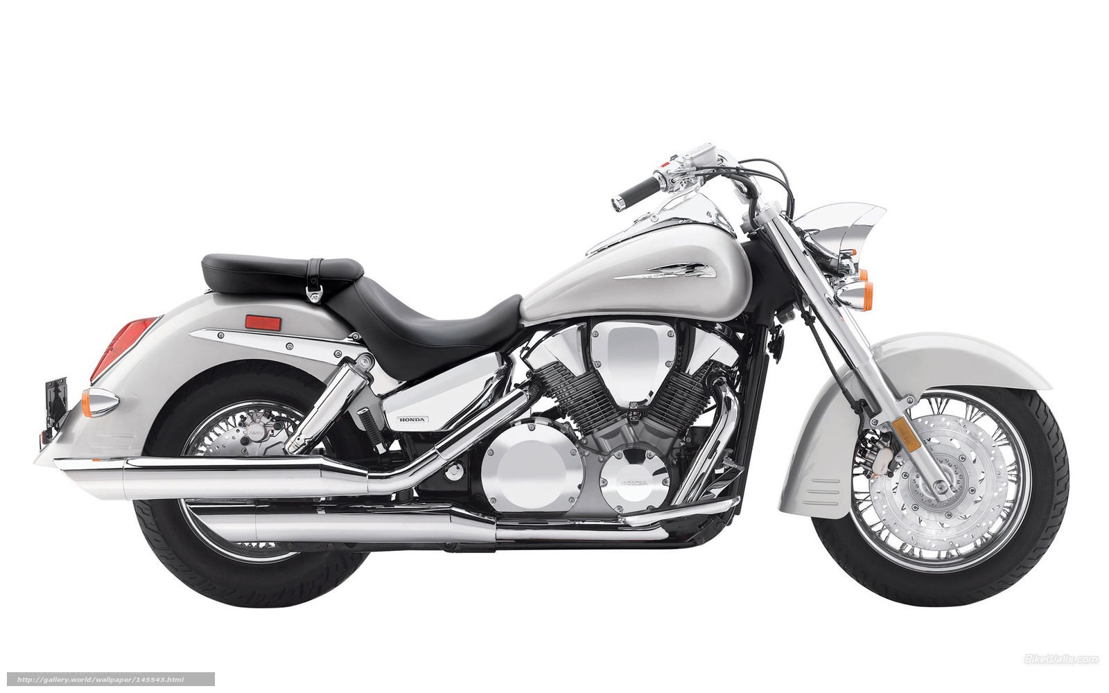 silver honda cruiser motorcycle