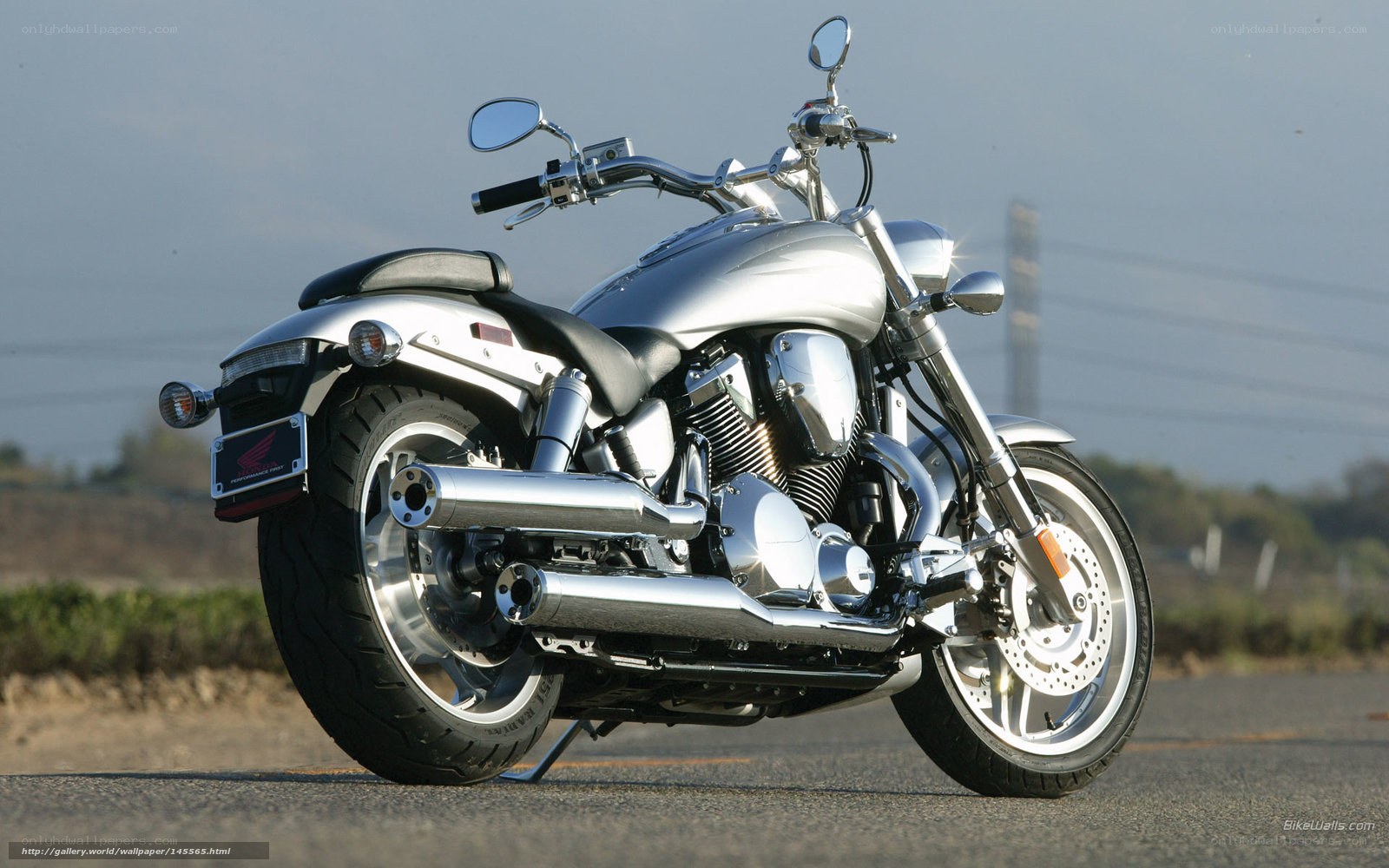 silver Honda cruiser motorcycle
