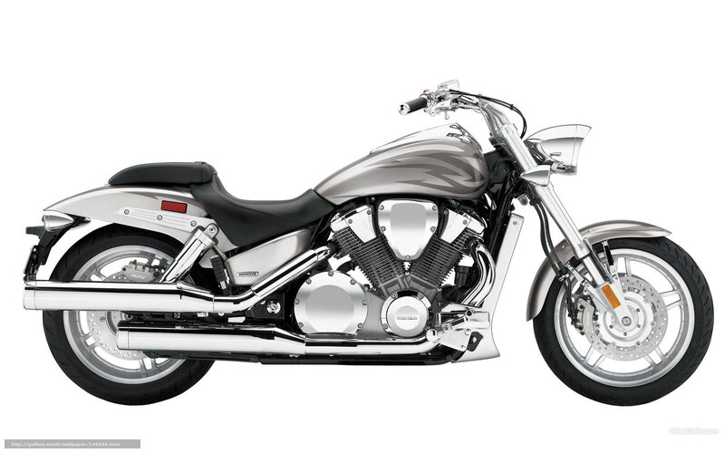silver Honda cruiser motorcycle